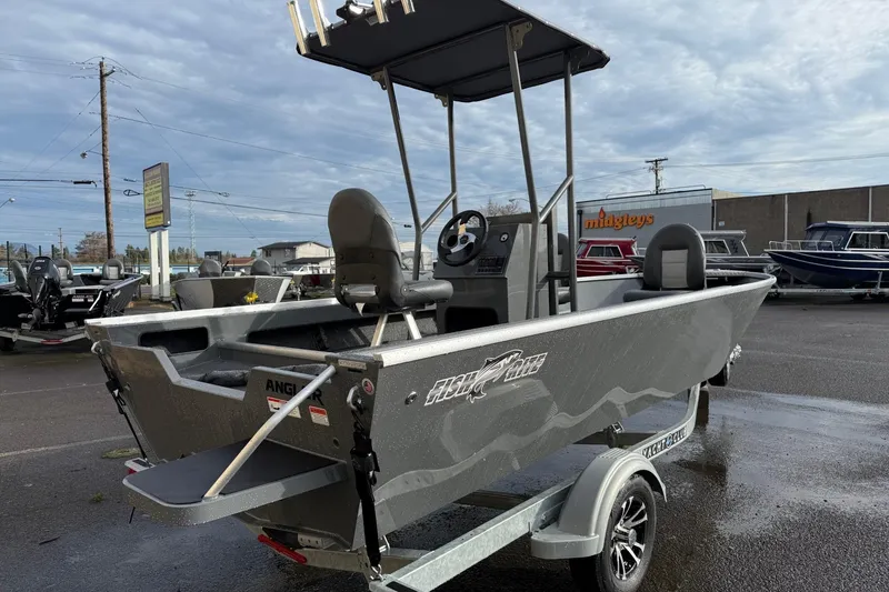 Slide: The Image of 2026 Fish Rite Angler 18 boat on trailer in outdoor dealership lot. - 4
