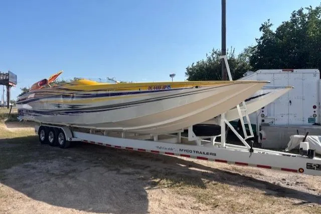 The Image of 2008 Nor-Tech 3600 Supercat powerboat on trailer, parked outdoors. - 0