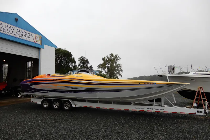 Slide: The Image of 2008 Nor-Tech 3600 Supercat boat on trailer at marina. - 16