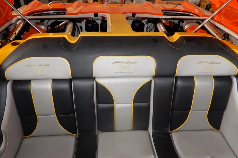 Slide: The Image of 2008 Nor-Tech 3600 Supercat interior with orange and black seating, showcasing luxury design. - 28