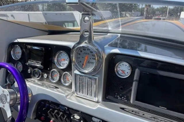 Slide: The Image of Dashboard of a 2008 Nor-Tech 3600 Supercat with gauges and controls. - 33