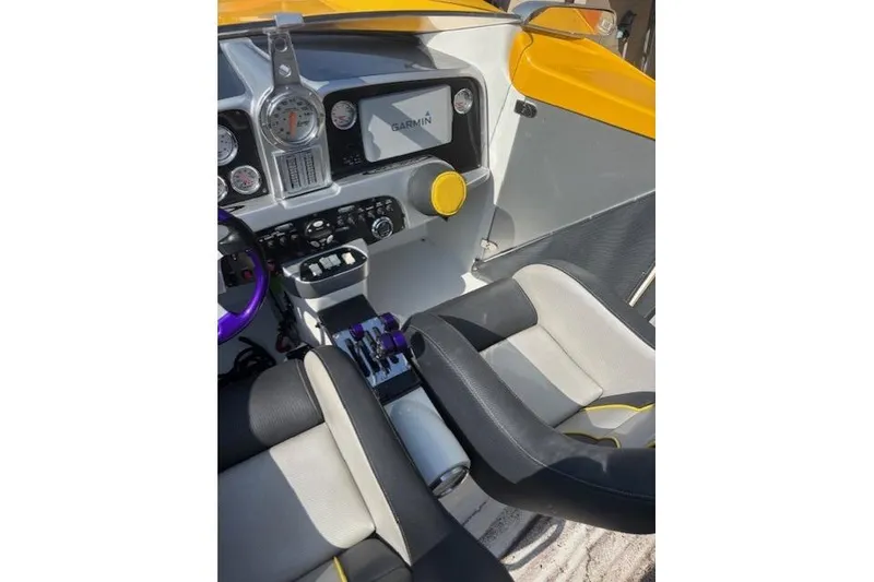 Slide: The Image of 2008 Nor-Tech 3600 Supercat cockpit with Garmin display and modern controls. - 34