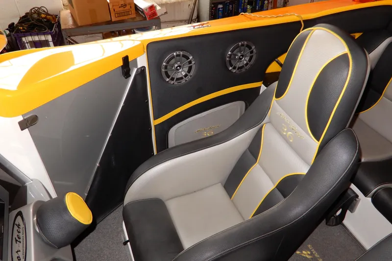Slide: The Image of 2008 Nor-Tech 3600 Supercat interior with black and yellow seating and audio speakers. - 36