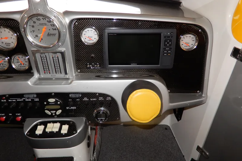 Slide: The Image of Dashboard of a 2008 Nor-Tech 3600 Supercat with gauges and Garmin display. - 37