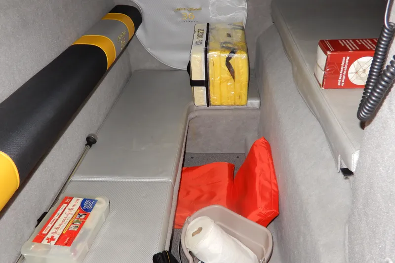 Slide: The Image of 2008 Nor-Tech 3600 Supercat interior with safety equipment and storage items. - 38