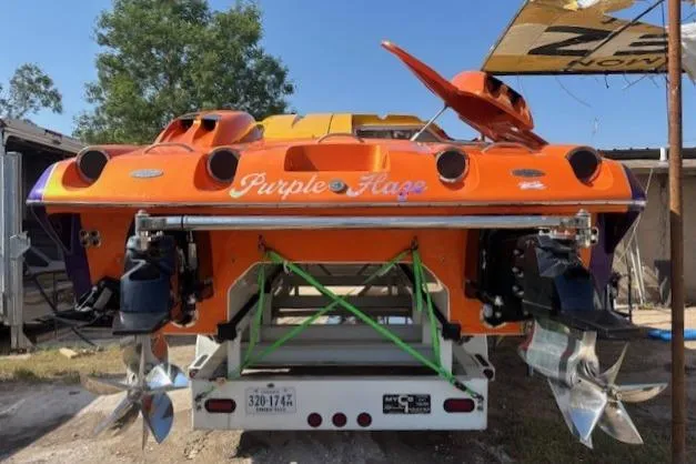 Slide: The Image of 2008 Nor-Tech 3600 Supercat "Purple Haze" powerboat on trailer, rear view. - 5