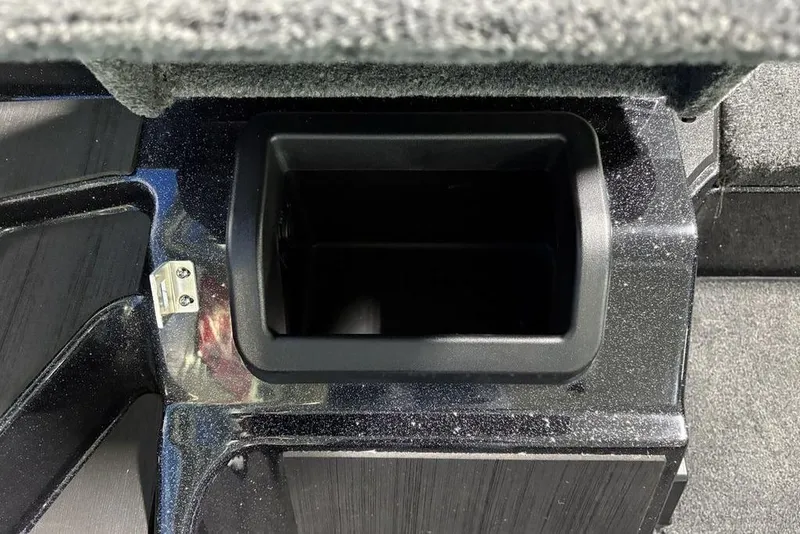 Slide: The Image of Storage compartment in 2026 Skeeter ZXE21 boat, featuring a sleek black interior design. - 19