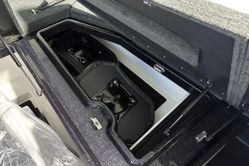 Slide: The Image of 2026 Skeeter ZXE21 boat storage compartment with dual battery setup. - 21