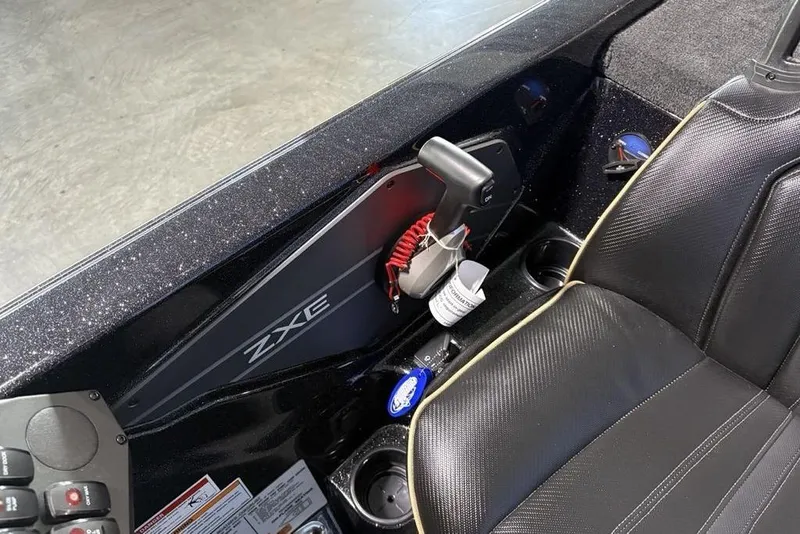 Slide: The Image of Interior of 2026 Skeeter ZXE21 boat with sleek black seating and control panel. - 23