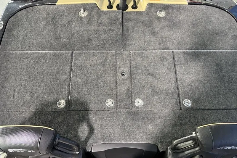 Slide: The Image of 2026 Skeeter ZXE21 boat deck with carpeted surface and storage compartments. - 27