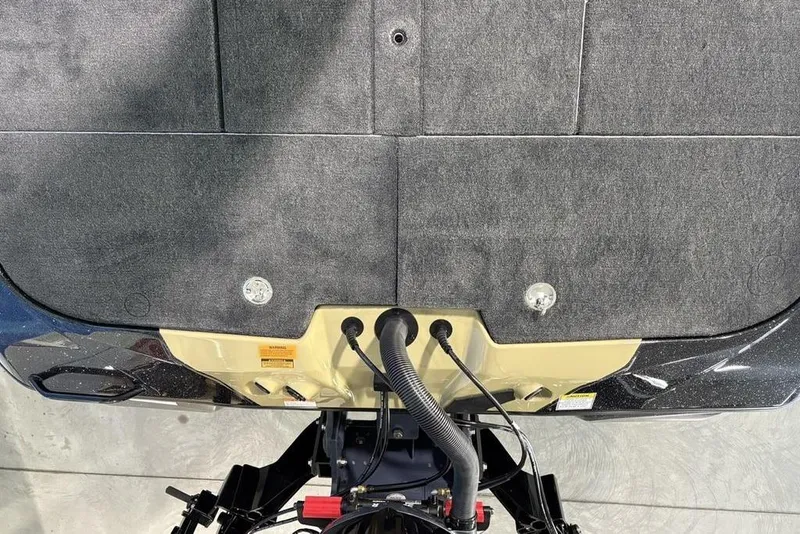 Slide: The Image of 2026 Skeeter ZXE21 boat transom with cables and carpeted surface. - 28