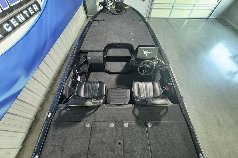 Slide: The Image of 2026 Skeeter ZXE21 boat interior with dual seats and modern dashboard. - 29