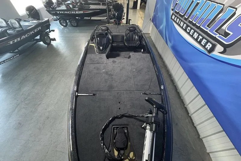 Slide: The Image of 2026 Skeeter ZXE21 boat displayed at Foothills Marine Center showroom. - 32