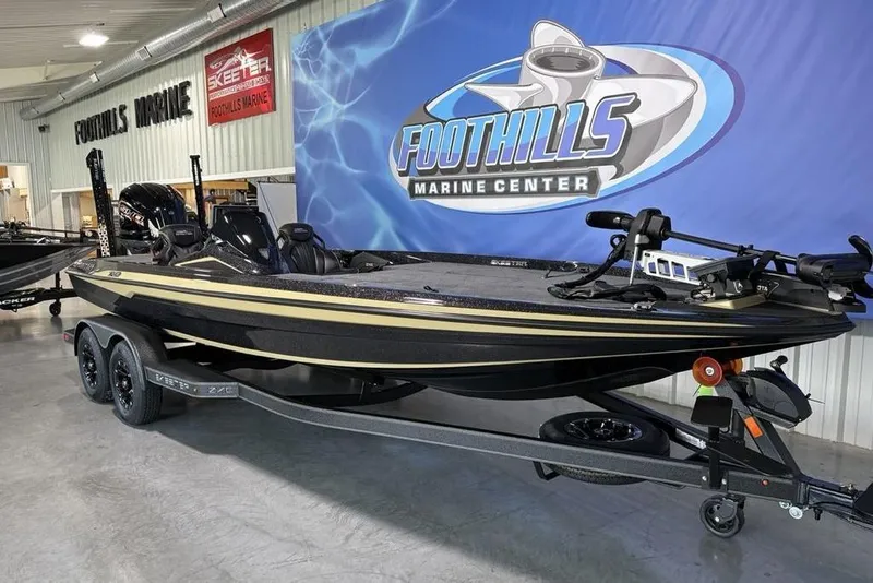 Slide: The Image of 2026 Skeeter ZXE21 boat displayed at Foothills Marine Center showroom. - 7