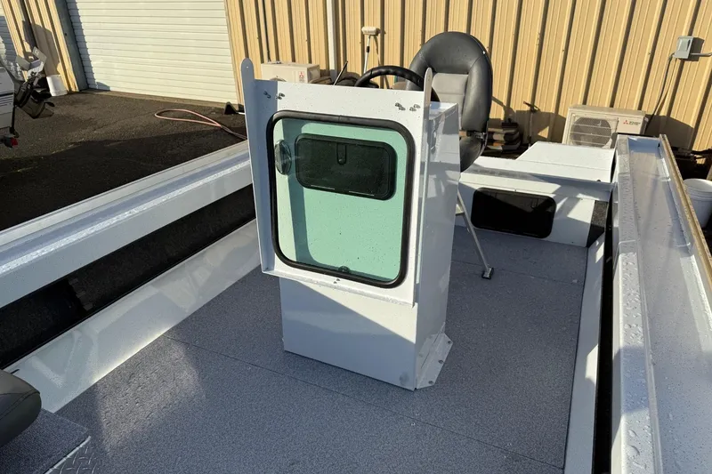Slide: The Image of 2026 Fish Rite Angler 18 boat interior with steering console and seat. - 11