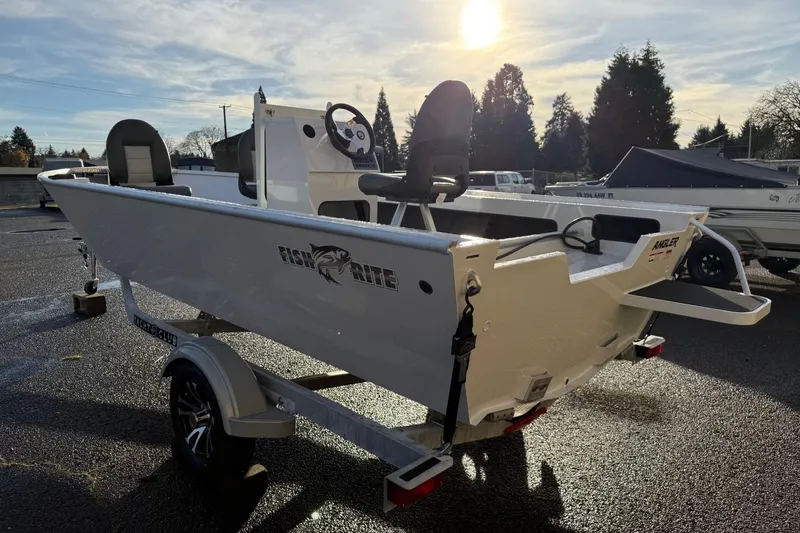 Slide: The Image of 2026 Fish Rite Angler 18 boat on trailer under sunny sky. - 3