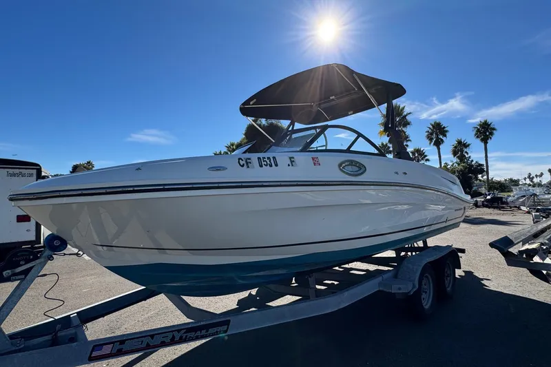 Slide: The Image of 2022 Bayliner VR6 Bowrider OB on trailer under sunny sky. - 11