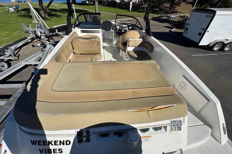 Slide: The Image of 2022 Bayliner VR6 Bowrider OB with tan seating, parked on a trailer. - 20