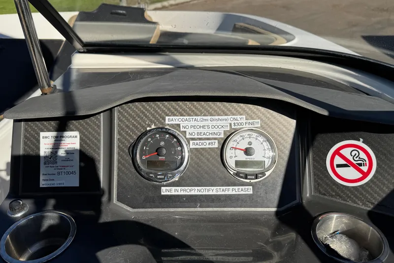 Slide: The Image of Dashboard of a 2022 Bayliner VR6 Bowrider OB with gauges and warning labels. - 36