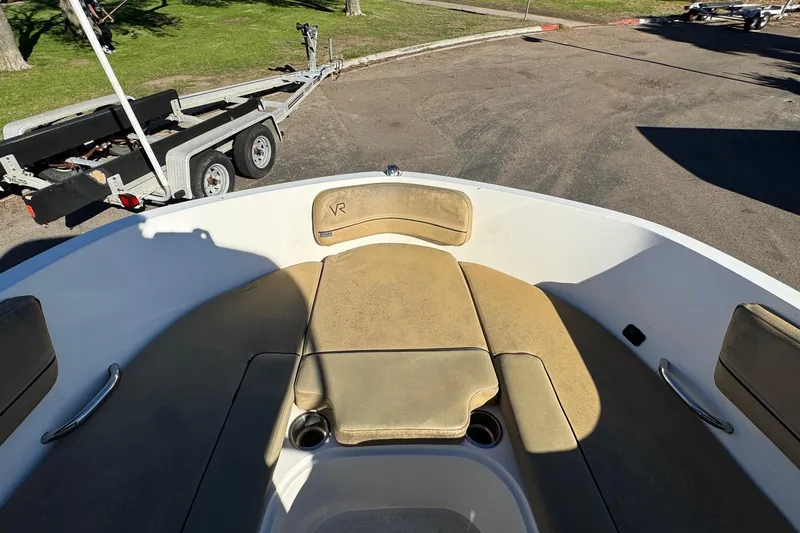 Slide: The Image of 2022 Bayliner VR6 Bowrider OB interior with tan seating and cup holders. - 42