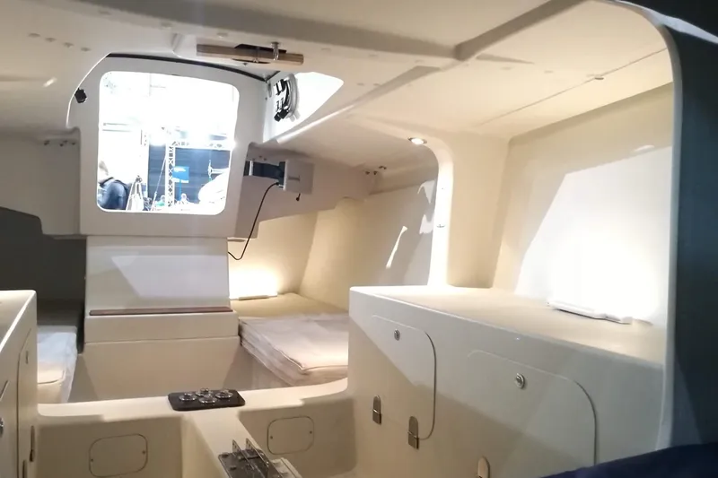 Slide: The Image of Interior of 2026 Brenta 30 sailboat, featuring modern design and cozy sleeping area. - 6