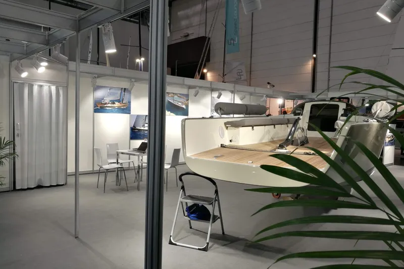 Slide: The Image of Exhibition booth showcasing Brenta 30 yacht model, 2026, with seating and promotional displays. - 4