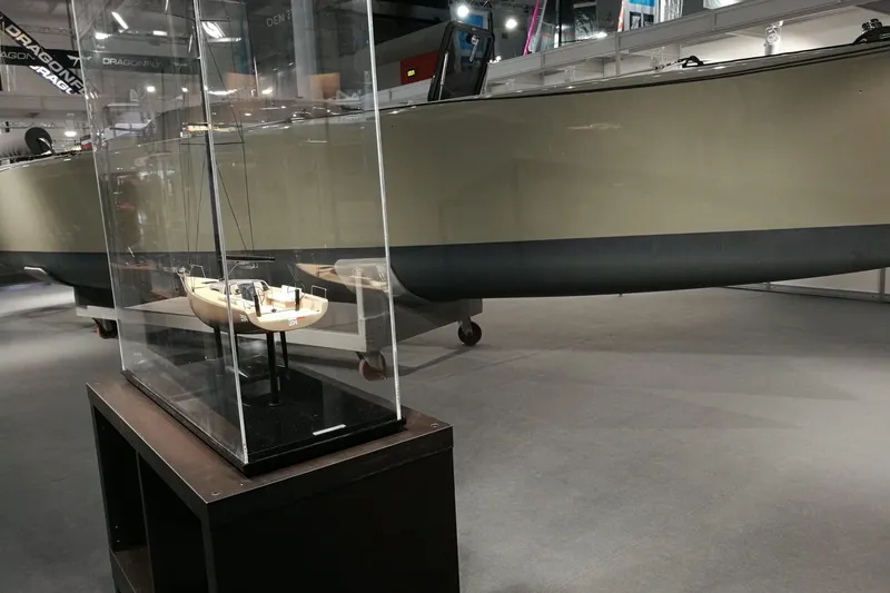 Slide: The Image of Model of Brenta 30 yacht displayed in a glass case at a boat show, 2026. - 9