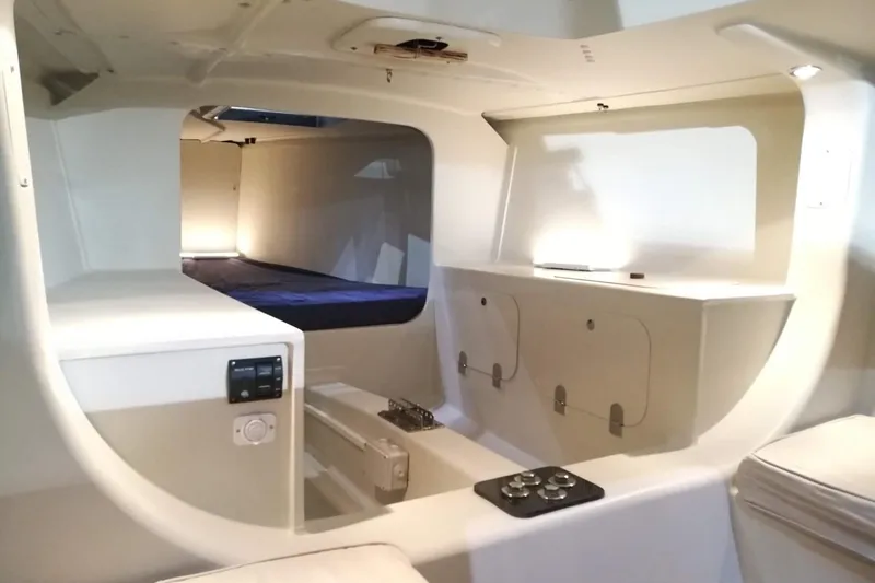 Slide: The Image of Interior of 2026 Brenta 30 yacht, featuring modern design and compact storage. - 8
