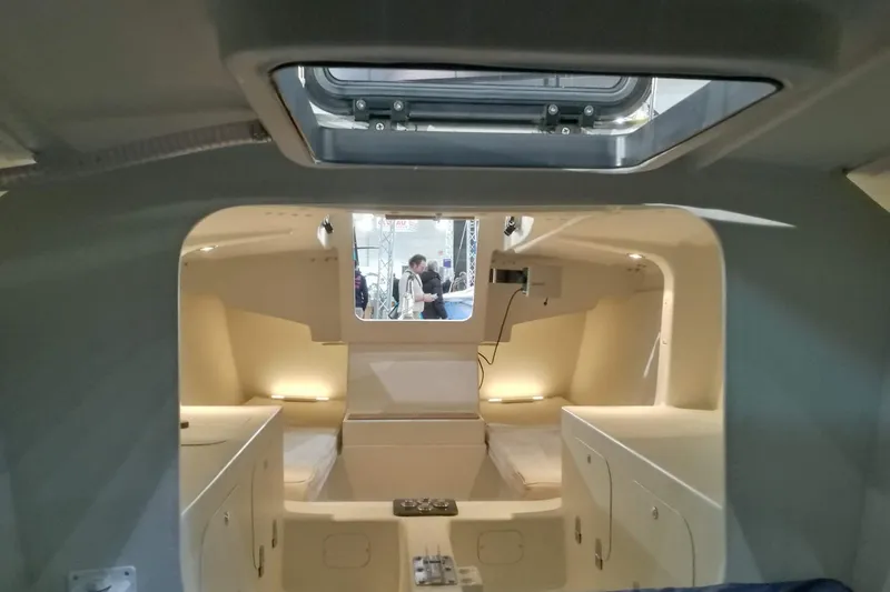 Slide: The Image of Interior of 2026 Brenta 30 sailboat, featuring modern cabin design and lighting. - 7