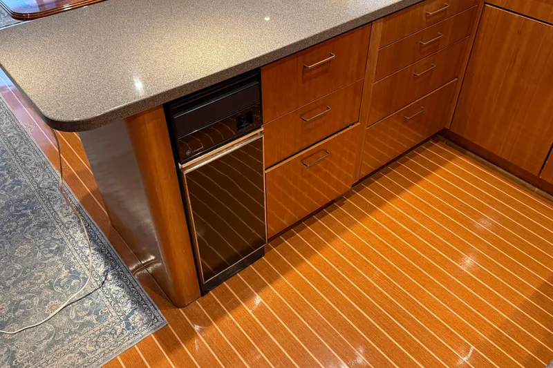 Slide: The Image of Luxurious kitchen interior of a 2000 Northern Pacific Motor Yacht with modern amenities. - 16
