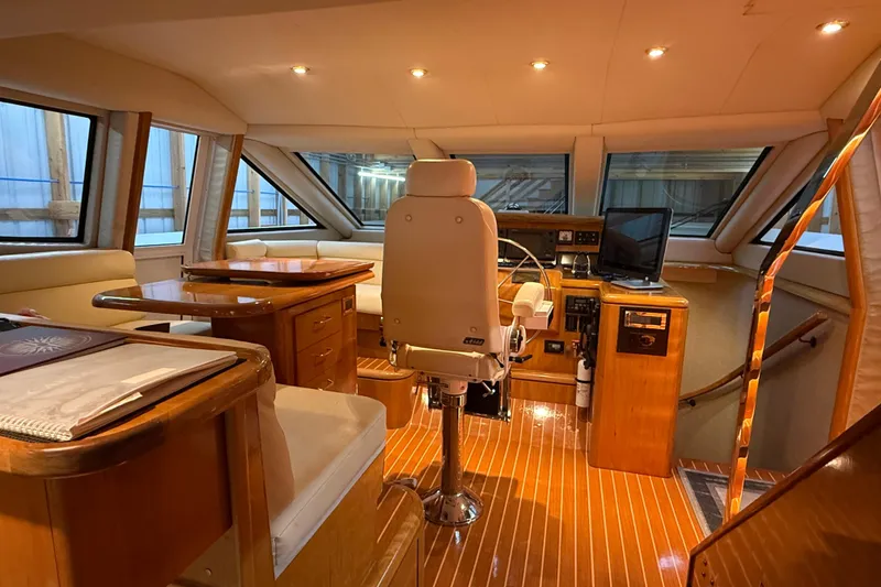 Slide: The Image of Luxurious kitchen in 2000 Northern Pacific Motor Yacht with modern appliances and wooden cabinetry. - 19