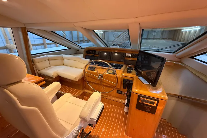 Slide: The Image of Polished wooden steps inside a 2000 Northern Pacific Motor Yacht. - 21