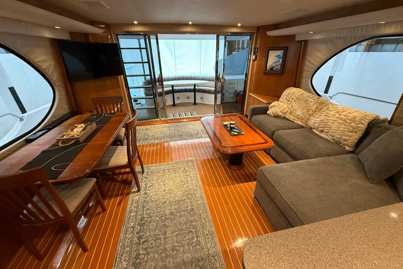 Slide: The Image of 2000 Northern Pacific Motor Yacht helm with captain's chair, steering wheel, and navigation equipment. - 24