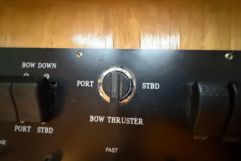 Slide: The Image of Cockpit of 2000 Northern Pacific Motor Yacht with wooden steering wheel and navigation equipment. - 29