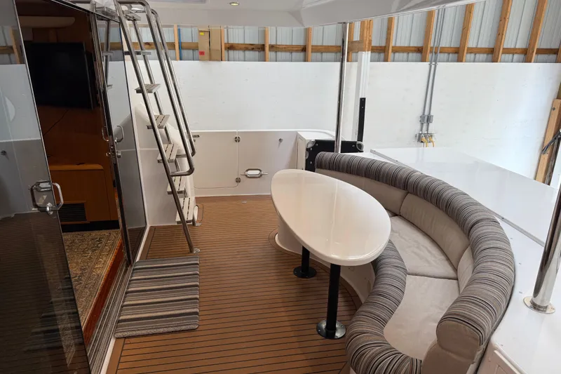 Slide: The Image of Northern Pacific 2000 Motor Yacht in storage, featuring a spacious deck and sleek design. - 3