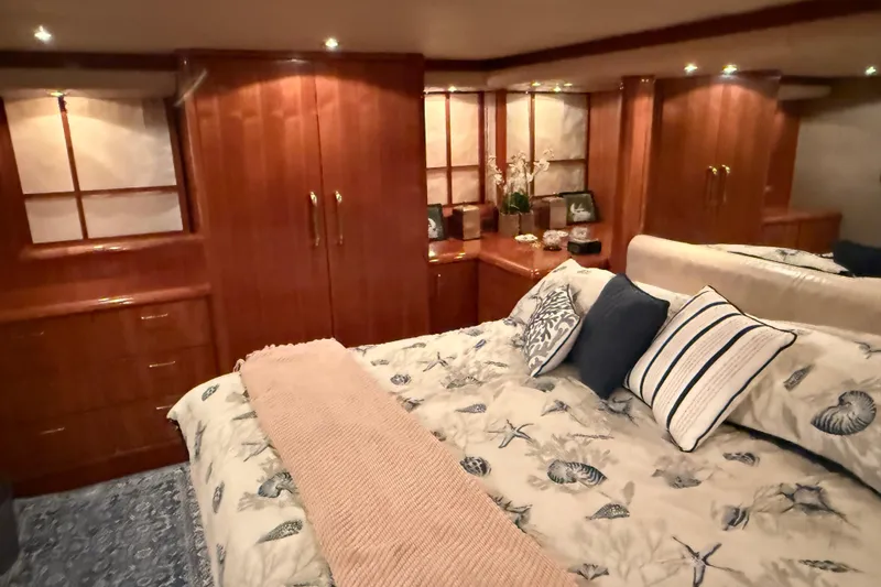 Slide: The Image of Hallway view inside 2000 Northern Pacific Motor Yacht, featuring wooden flooring and bedroom access. - 39