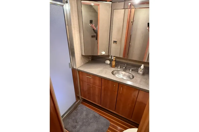 Slide: The Image of Luxurious bedroom interior of 2000 Northern Pacific Motor Yacht with elegant wood finishes. - 40