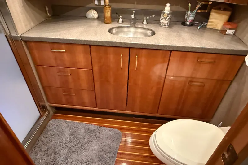 Slide: The Image of Luxurious bedroom in 2000 Northern Pacific Motor Yacht with elegant wood cabinetry. - 41