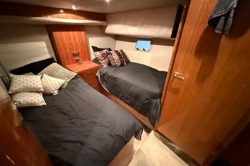 Slide: The Image of Luxurious bedroom interior of 2000 Northern Pacific Motor Yacht with elegant wood finishes. - 43