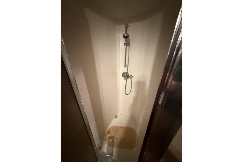 Slide: The Image of Luxurious bathroom in 2000 Northern Pacific Motor Yacht with wooden cabinetry and modern fixtures. - 45