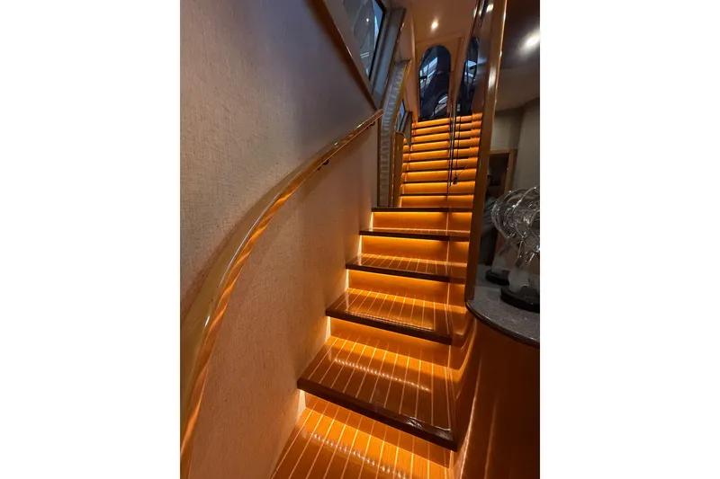 Slide: The Image of Cozy cabin interior of 2000 Northern Pacific Motor Yacht with striped bedding and nautical decor. - 52