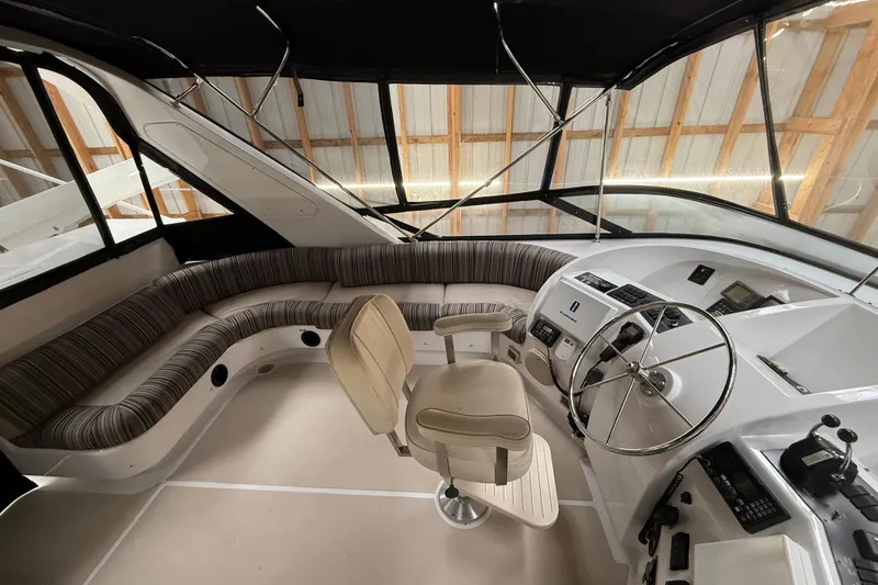 Slide: The Image of Staircase inside 2000 Northern Pacific Motor Yacht with wooden steps and nautical decor. - 58