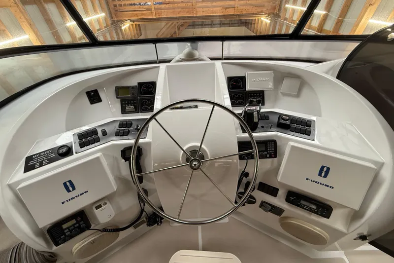 Slide: The Image of Staircase inside 2000 Northern Pacific Motor Yacht, featuring polished wooden steps. - 59