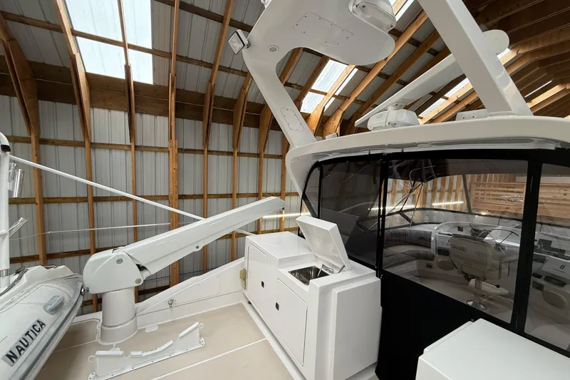 Slide: The Image of 2000 Northern Pacific Motor Yacht cockpit with steering wheel and control panels. - 61