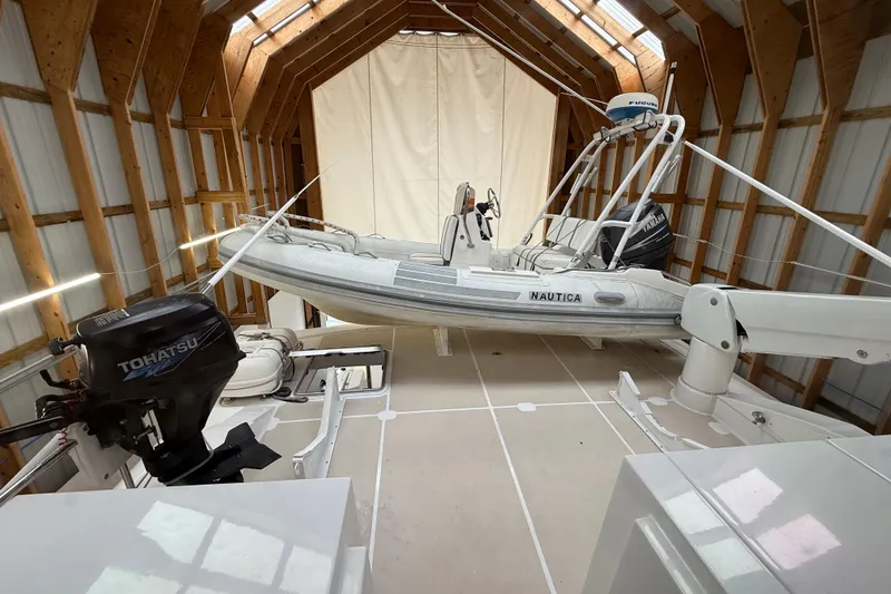 Slide: The Image of Northern Pacific 2000 motor yacht interior with modern equipment and sleek design in a wooden boathouse. - 65