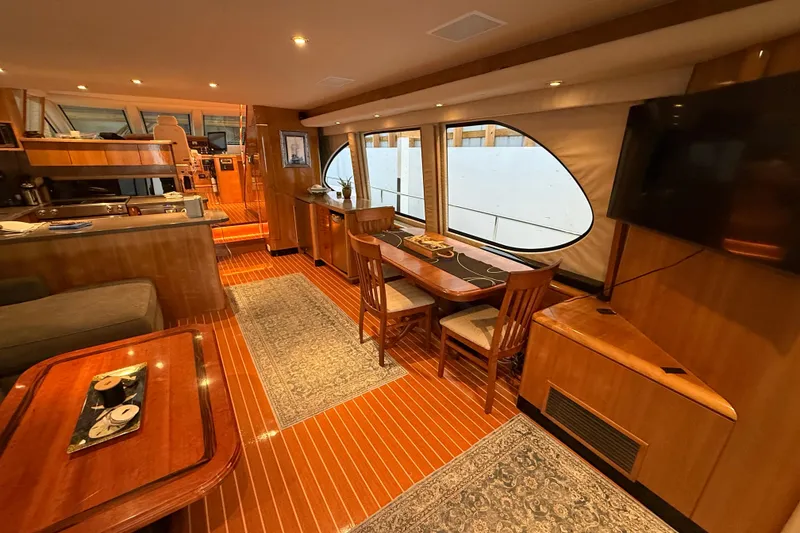 Slide: The Image of Northern Pacific 2000 Motor Yacht interior with curved seating and table on deck. - 7