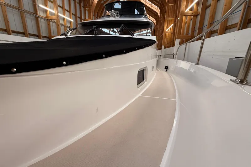 Slide: The Image of Inflatable boat stored inside wooden boathouse, Northern Pacific Motor Yacht, 2000 model. - 70