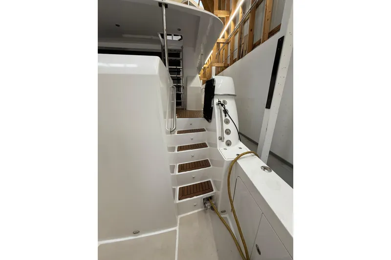 Slide: The Image of Side view of a 2000 Northern Pacific Motor Yacht in a wooden boathouse. - 71