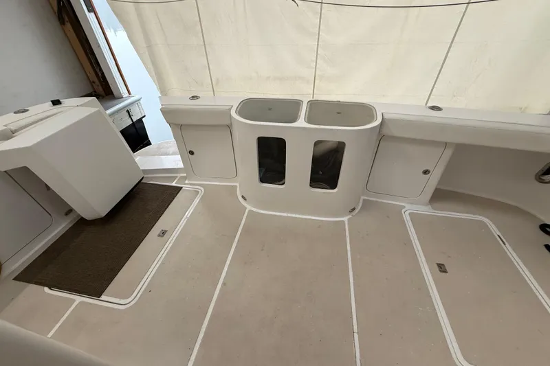 Slide: The Image of Northern Pacific Motor Yacht 2000 in storage, showcasing sleek white deck and wooden interior elements. - 73