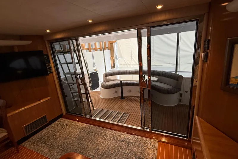 Slide: The Image of Luxurious interior of a 2000 Northern Pacific Motor Yacht with elegant wood flooring. - 8